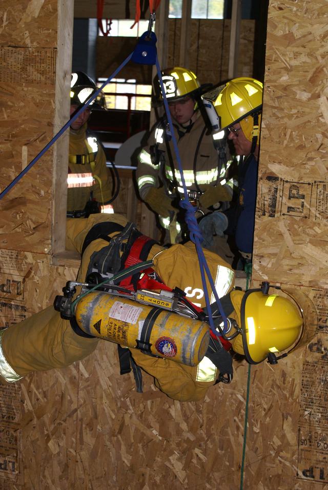 Christina Barbour exits 2nd story window using bail out rope during New York State Firefighter Survival course in Willsboro NY 9/25/2010